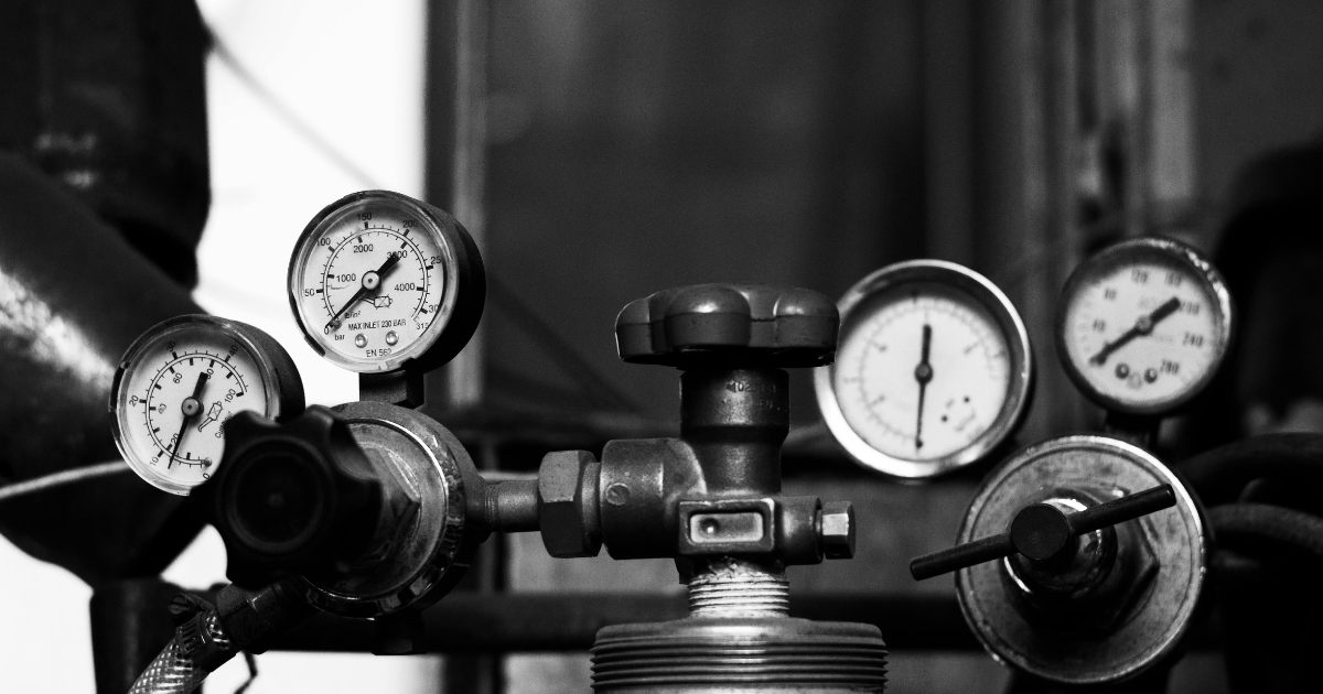 Pressure in the workplace, illustrated by a series of pressure valves in a black and white image.